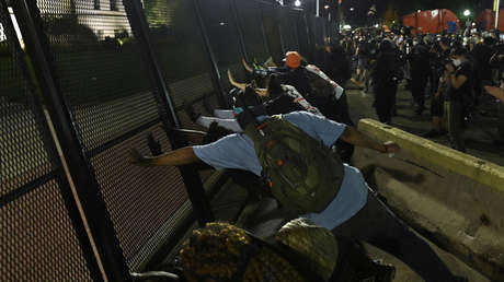 People protest after a Black man identified as Jacob Blake was shot several times by police in Kenosha